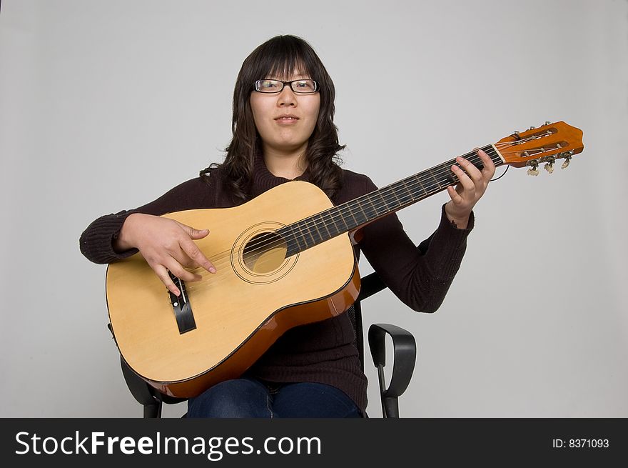 Female amateur guitarist leisure Living. Female amateur guitarist leisure Living