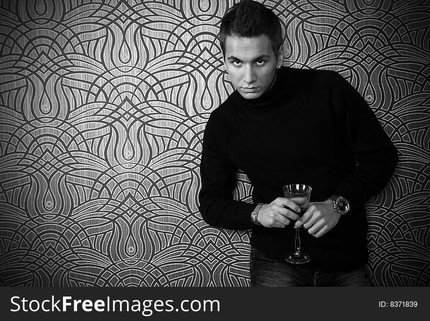 Handsome man with glass of wine