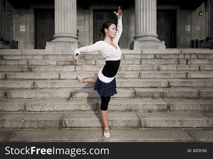 A female dancer dancing in the outdoors. A female dancer dancing in the outdoors