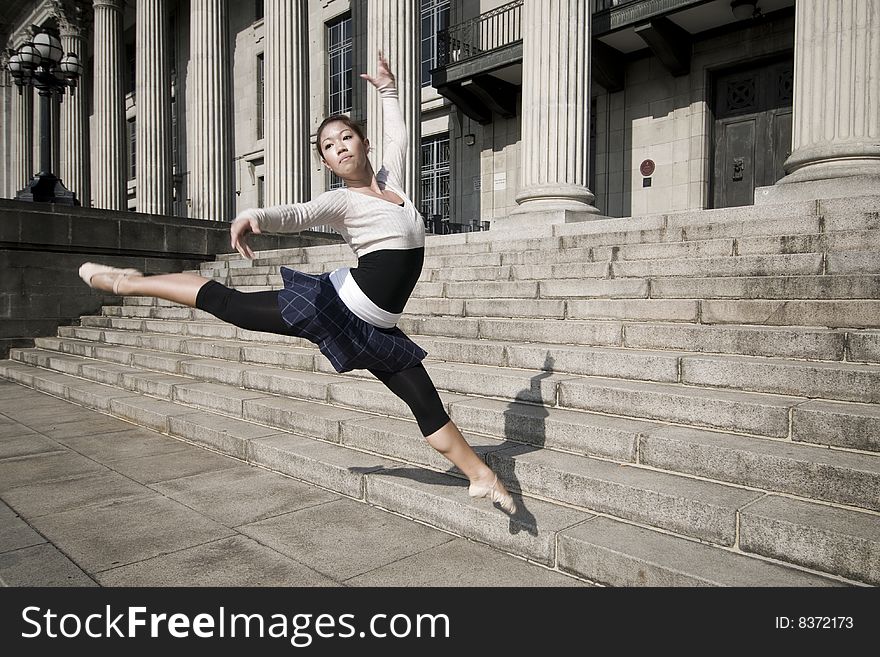 A female dancer dancing in the outdoors. A female dancer dancing in the outdoors