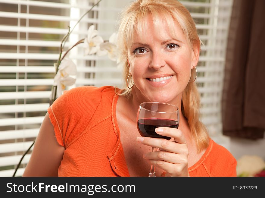 Attractive Blond With A Glass Of Wine