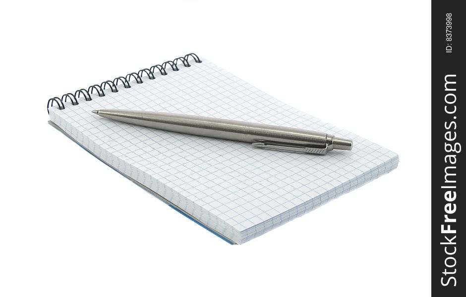 Notebook and pen on it isolated over white