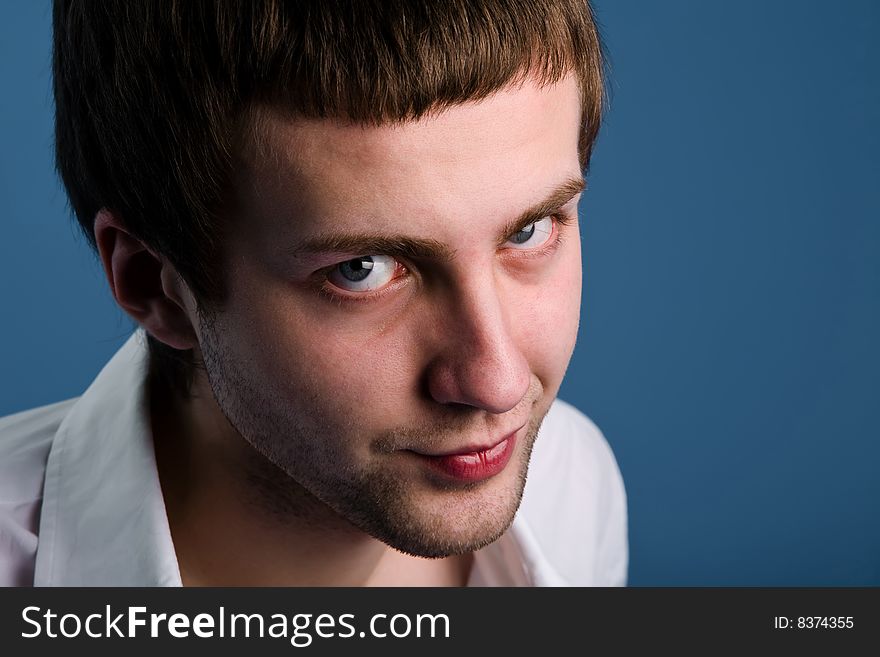 Man With Fixed Look Over Blue Background