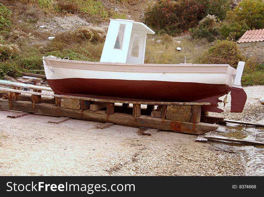 A small fishing boat at a slipway. A small fishing boat at a slipway