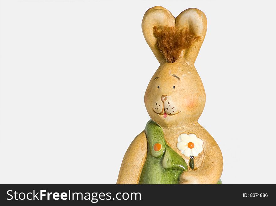 Easter-bunny with flower in front of a white background