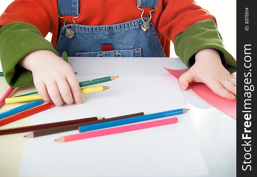 Many color pencils in children's hands. Many color pencils in children's hands