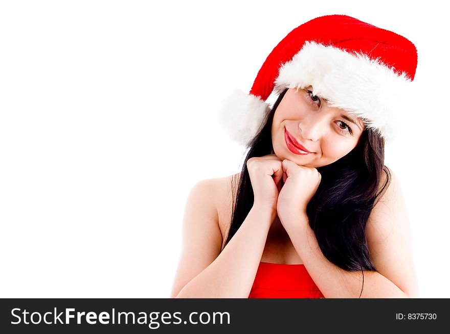Beautiful young woman in christmas hat smiling against white background