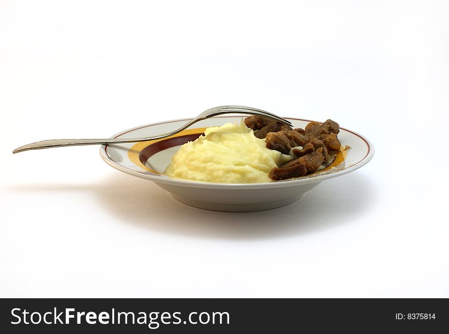Plate with a porridge and slices of a beef. Plate with a porridge and slices of a beef.