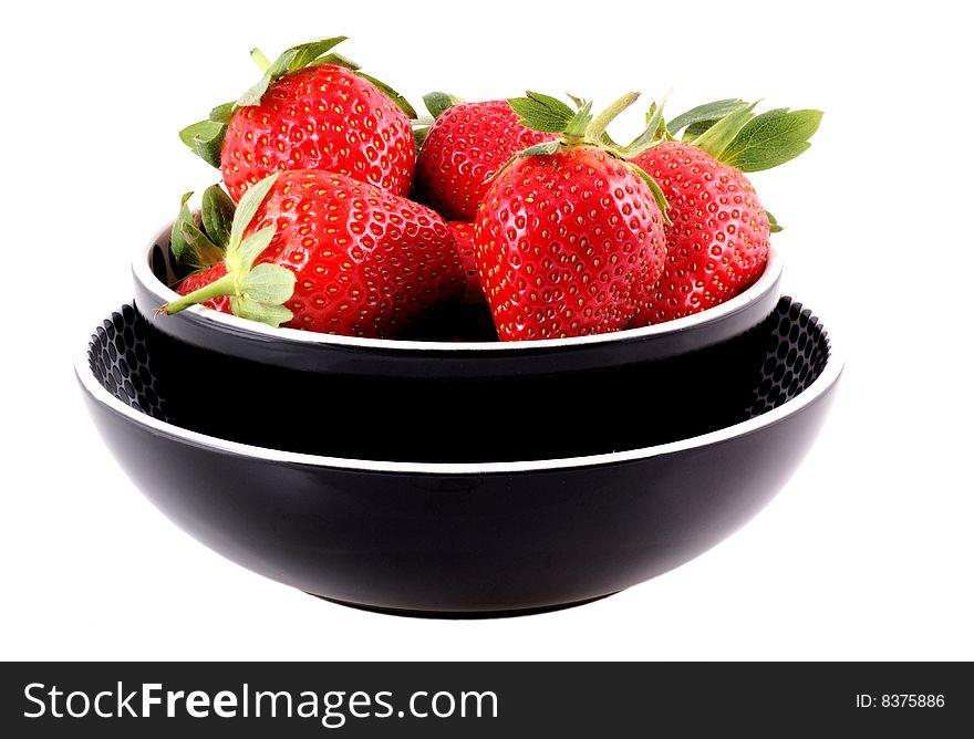 Bowl full of nice ripe strawberries isolated on white. Bowl full of nice ripe strawberries isolated on white.