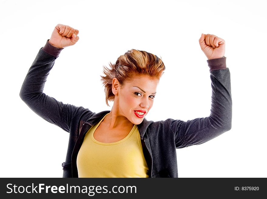 Close up of attractive woman in winning gesture on an isolated background