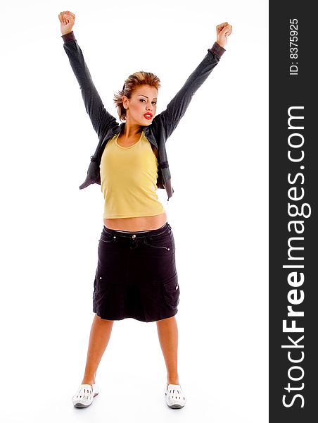 Standing sexy woman showing winning gesture on an isolated background