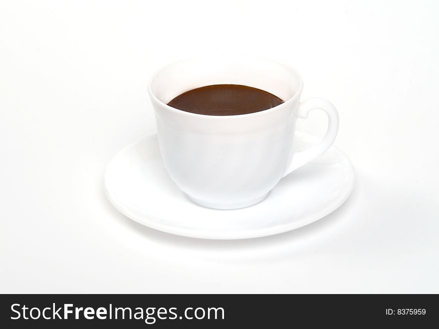 A cup of caffee on a white table
