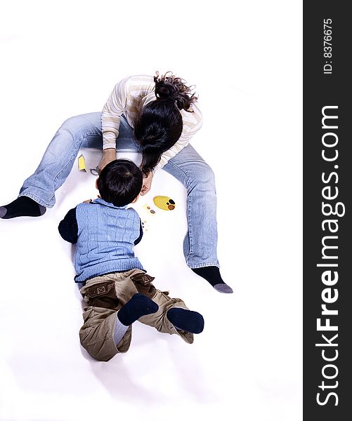 a picture of a little chinese boy playing games with his mother and having great fun. a picture of a little chinese boy playing games with his mother and having great fun