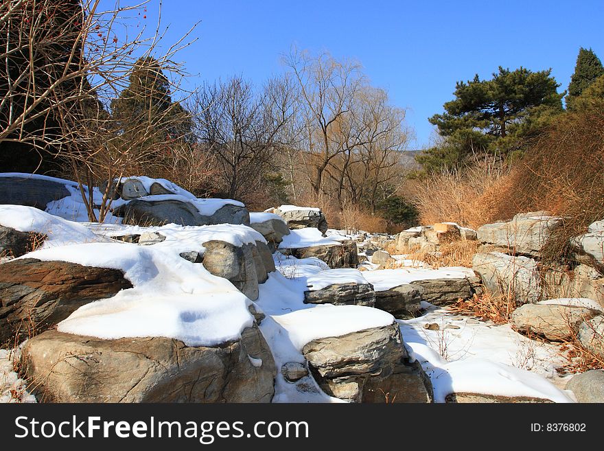 Winter park in snow with blue sky