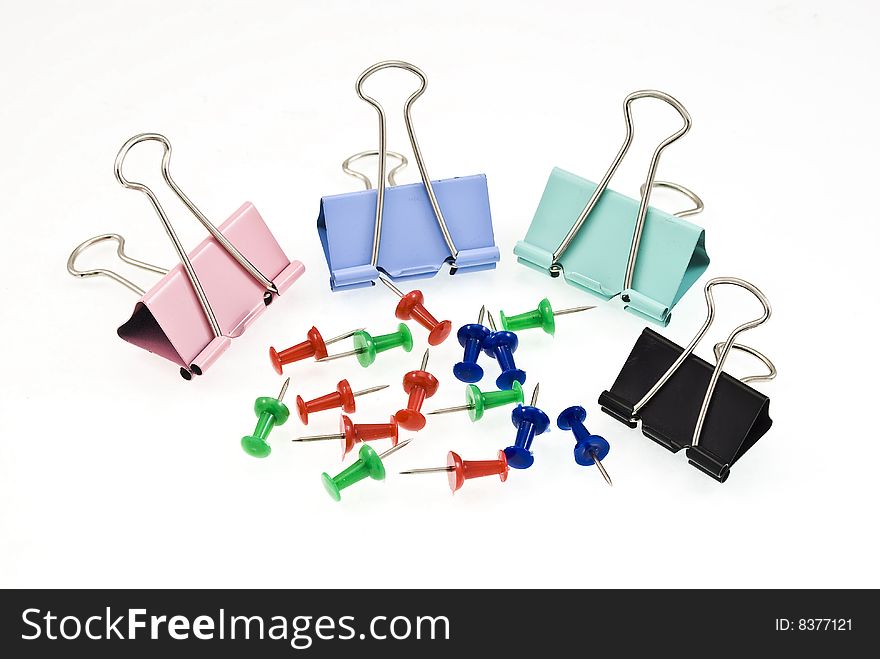 Document clips and pins on white background