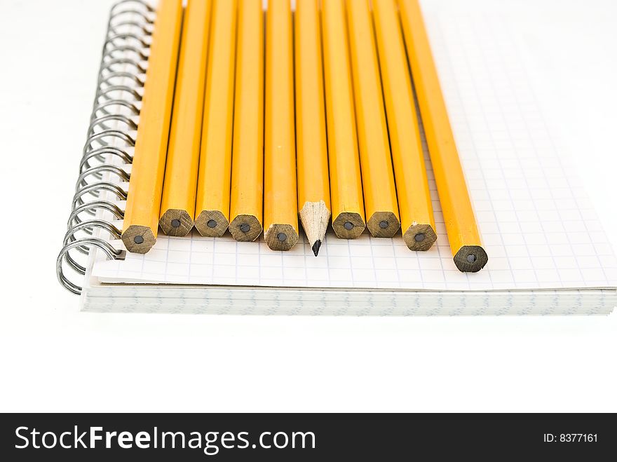 Spiral notepad with a set yellow wooden pencils. Spiral notepad with a set yellow wooden pencils.