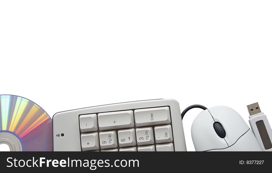 Keyboard, mouse, disc and flash on white