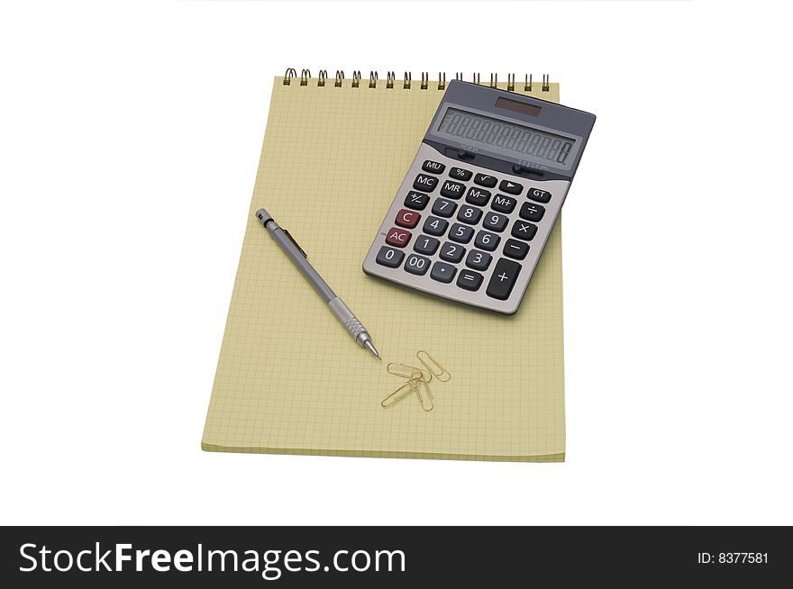 Yellow spiral bound notepad with pen and calculator isolated on white