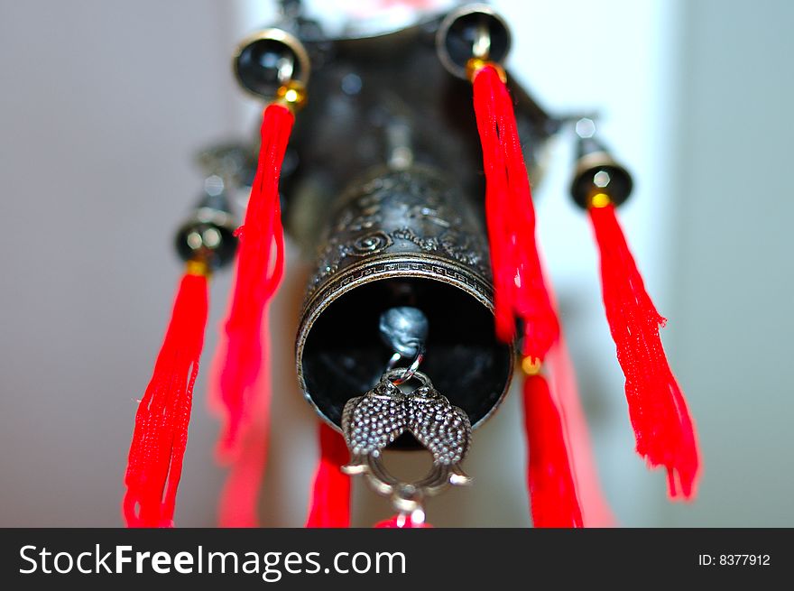 Old chinese bronze bell with dragons and hieroglyphs - on defocused (blurred) background. Old chinese bronze bell with dragons and hieroglyphs - on defocused (blurred) background.