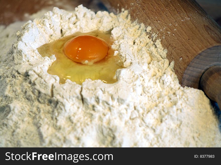 Egg, flour and rolling-pin. Egg, flour and rolling-pin