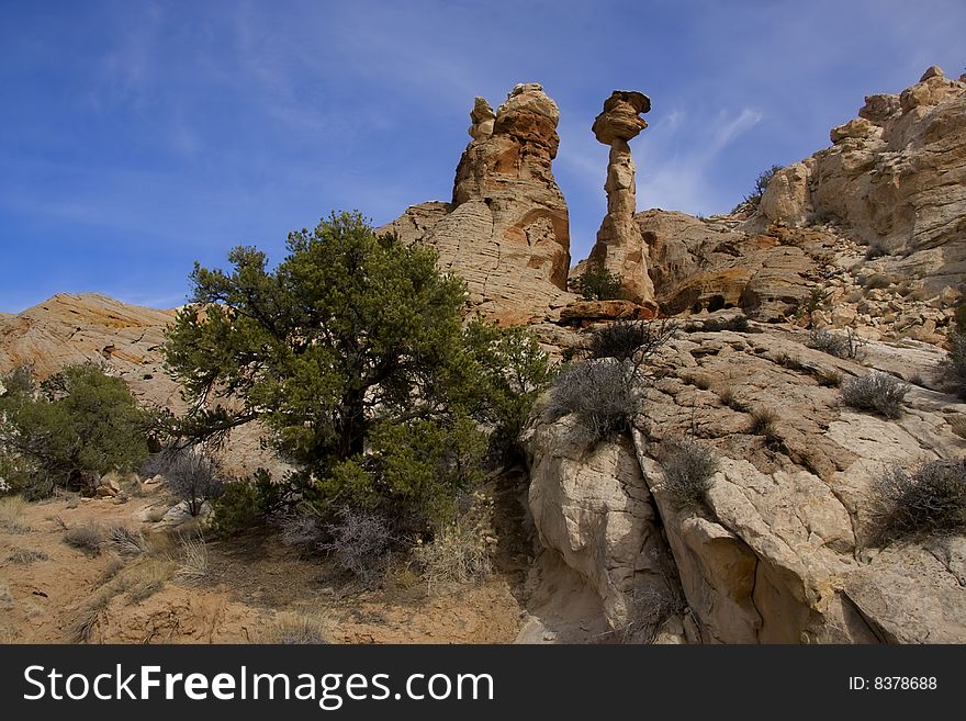 View of the red rock formations in San Rafael Swell with blue skyï¿½s and clouds