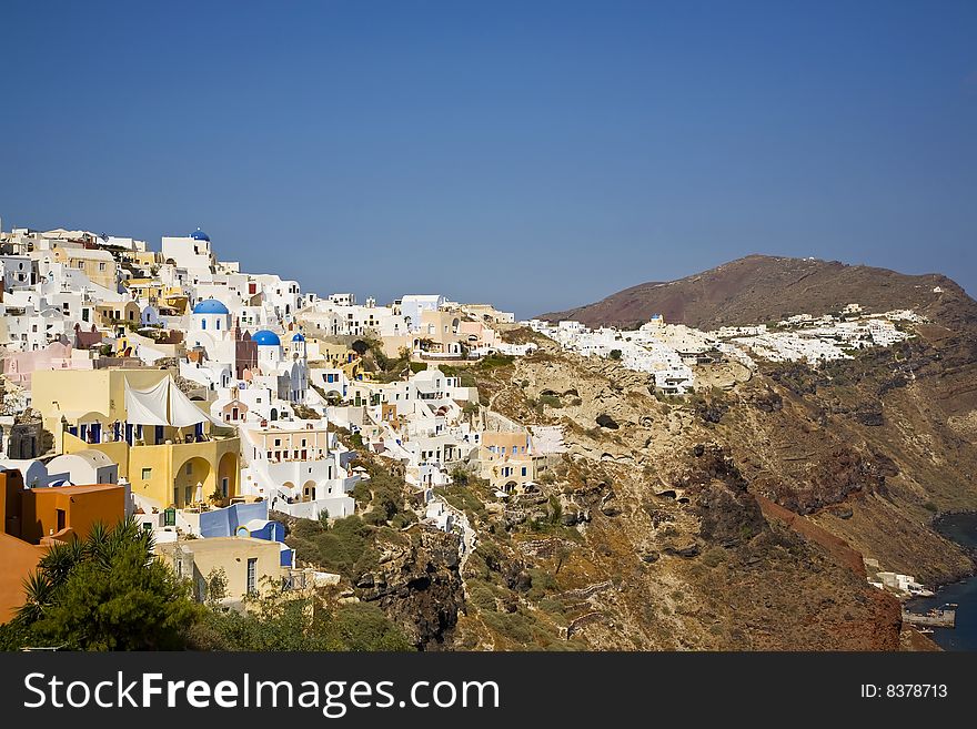 Oia is a village built along a cliff-top. On the greek island called Santorini on the northern tip. Oia is a village built along a cliff-top. On the greek island called Santorini on the northern tip.