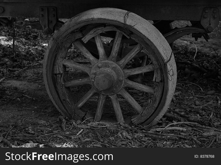 Old wheel on an anicent trailor. Old wheel on an anicent trailor