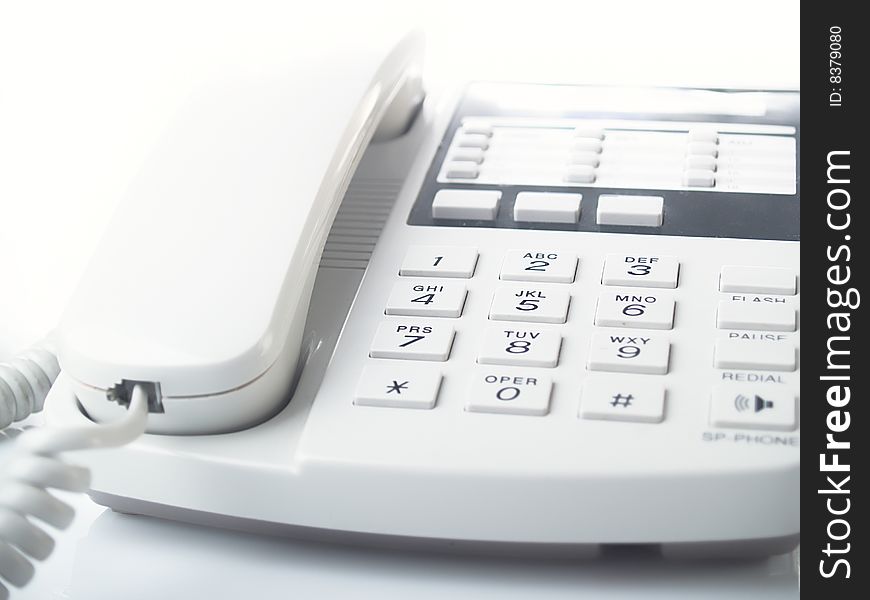 Modern white business office telephone  on a white background