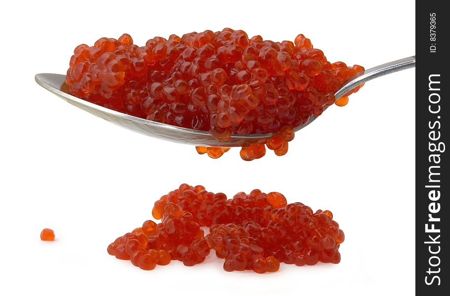 Red caviar on a spoon isolated over white background. Red caviar on a spoon isolated over white background