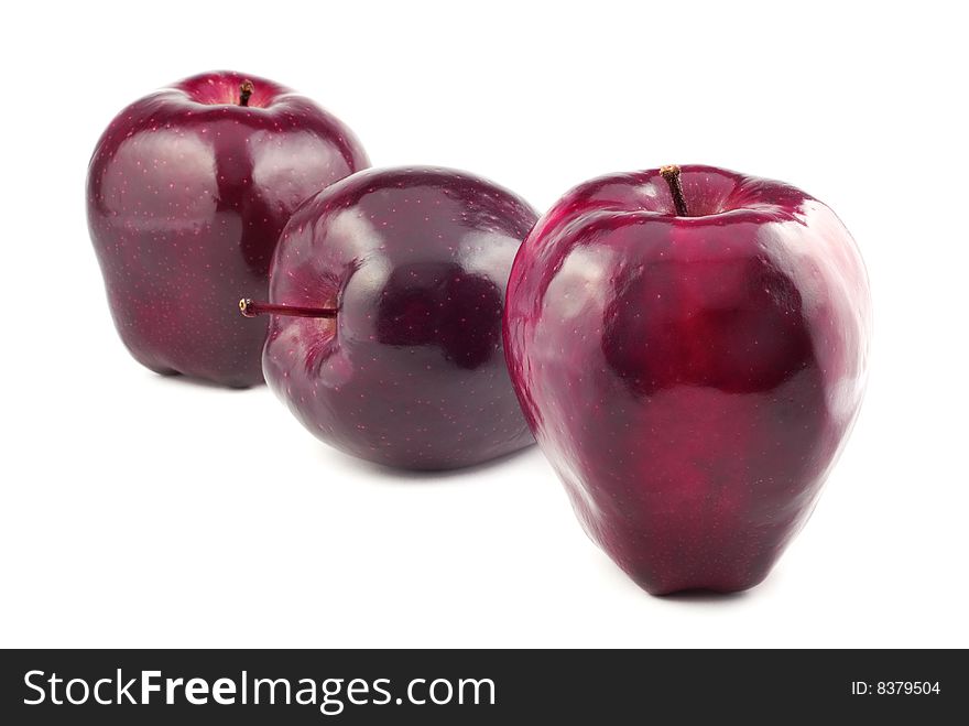 Three red apples in a row isolated on white background with copy space