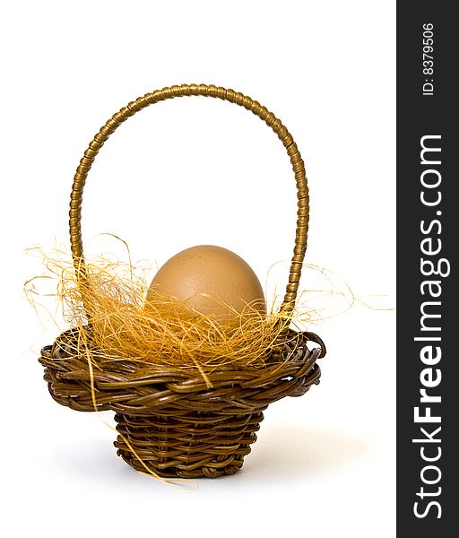 Basket with egg isolated on white background