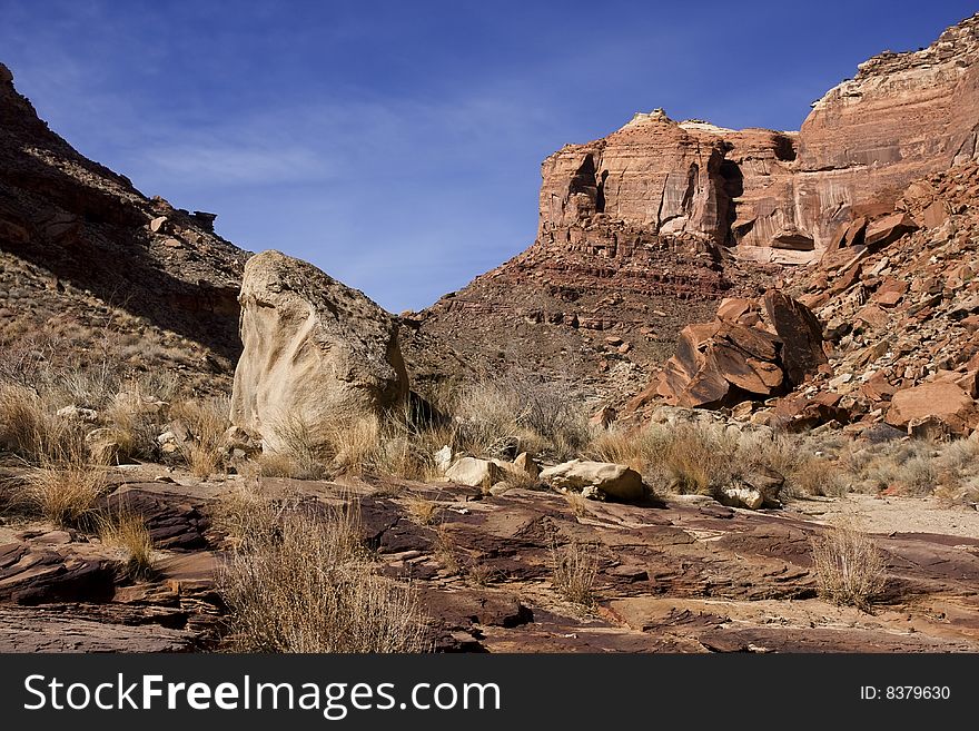 View of the red rock formations in San Rafael Swell with blue skyï¿½s and clouds