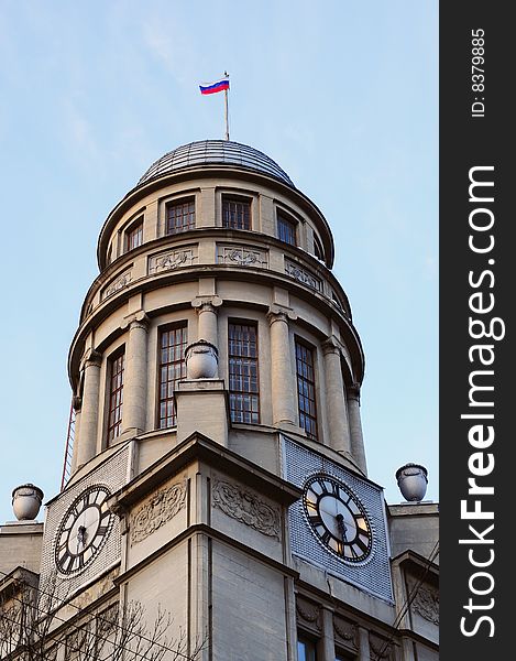 Horologium with russian flag. Building tower in Moscow, capital of Russian Federation