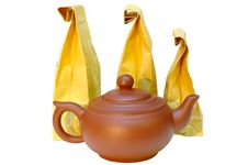 Pottery (clay) Teapot And Tea In Paper Bags. Royalty Free Stock Photos Pottery (clay) Teapot And Tea In Paper Bags. Royalty Free Stock Photos