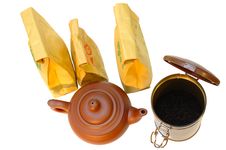 Pottery (clay) Teapot, Tea In Paper Bags And Tin. Stock Image Pottery (clay) Teapot, Tea In Paper Bags And Tin. Stock Image