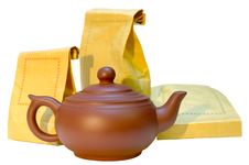Pottery (clay) Teapot And Tea In Paper Bags. Stock Photography Pottery (clay) Teapot And Tea In Paper Bags. Stock Photography