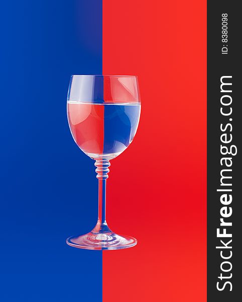 Water glass on the two color background. Water glass on the two color background