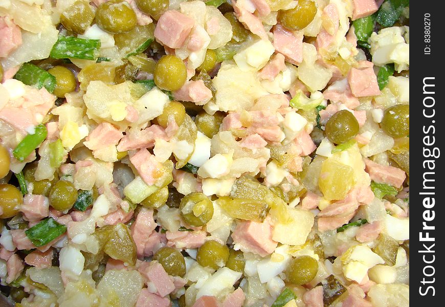 Salad with pickles and green peas under the Russian recipe