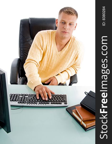 Handsome guy working on computer on an isolated background