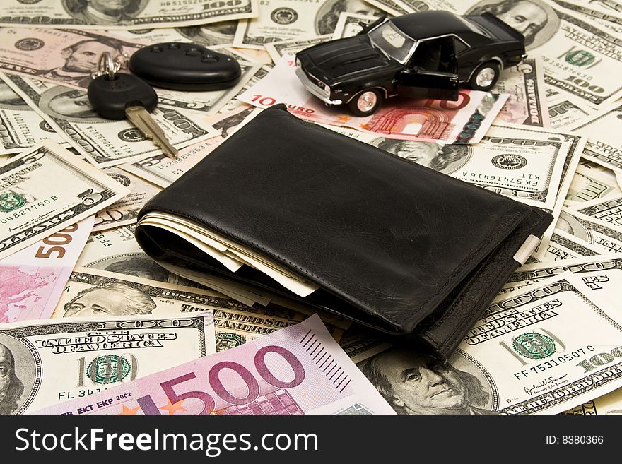 Leather wallet,keychain,car  on dollars