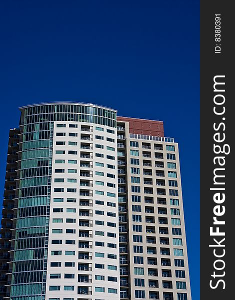 A high rise condo complex on a deep blue sky. A high rise condo complex on a deep blue sky