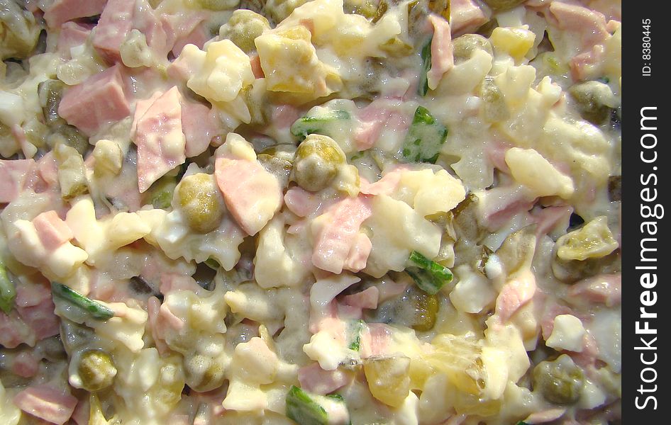 Salad with pickles and green peas under the Russian recipe