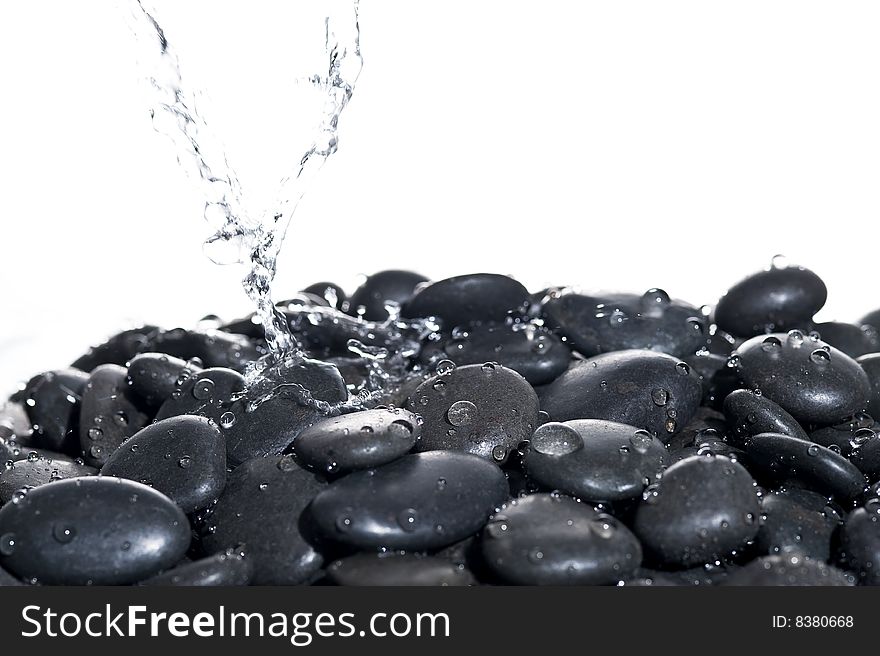 Background rock with splashing water.