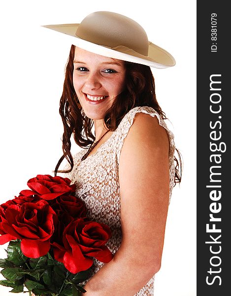 Beautiful lady in a beige dress and hat standing in the studio with red roses
in her arm's smiling, for white background. Beautiful lady in a beige dress and hat standing in the studio with red roses
in her arm's smiling, for white background.