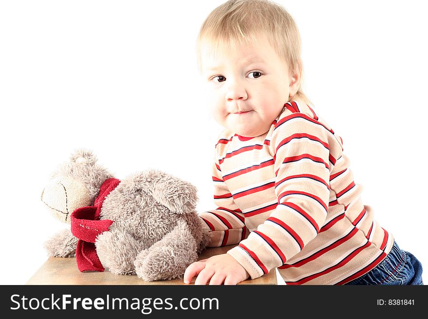 Little blond boy with teddy bear isolated on white background