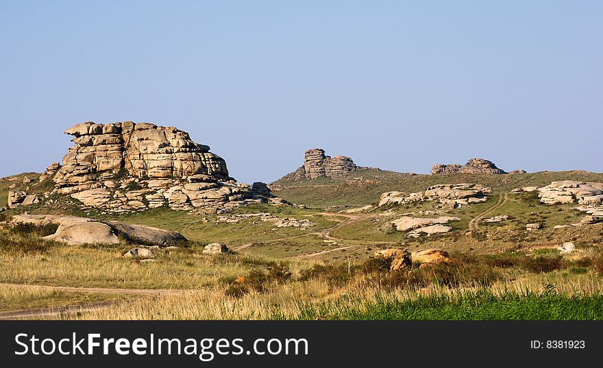 Mountain with rocks under blue sky. Mountain with rocks under blue sky