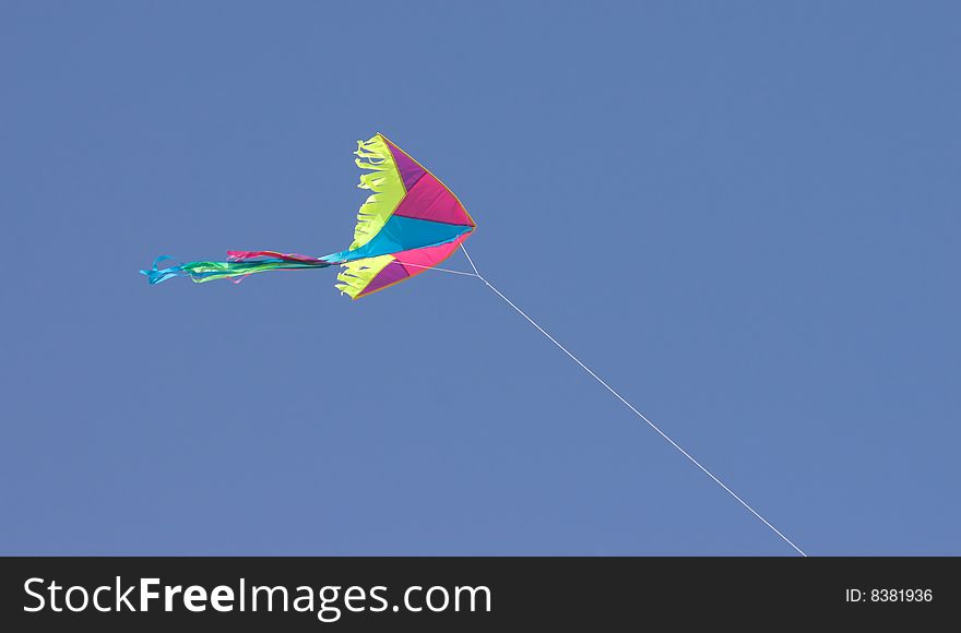 Colored kite in blue sky. Colored kite in blue sky