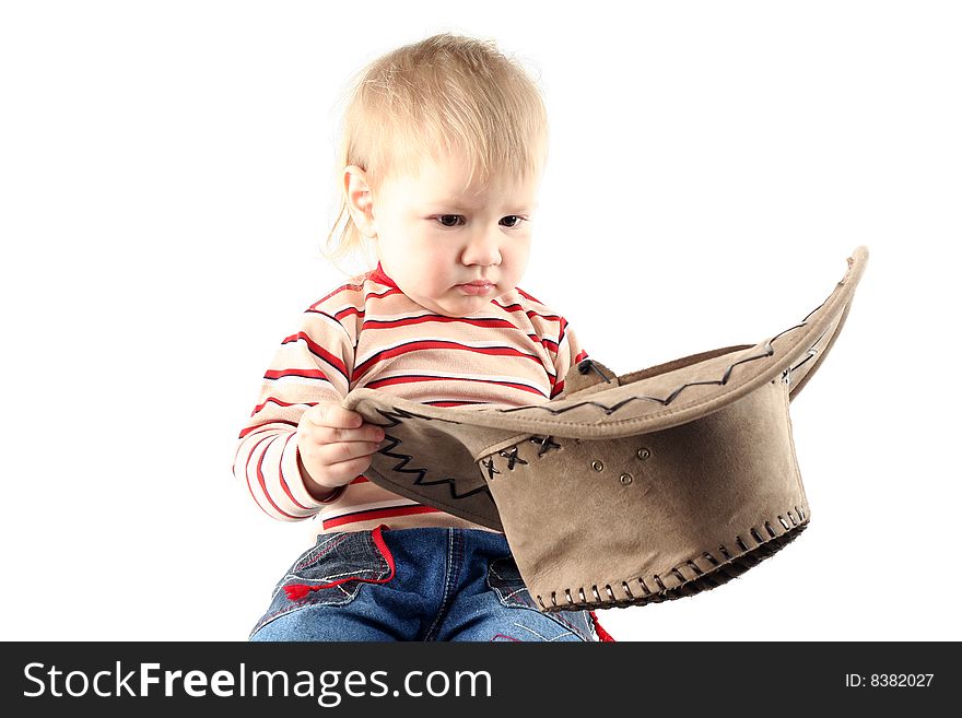 Little boy in cowboy hat isolated on white background