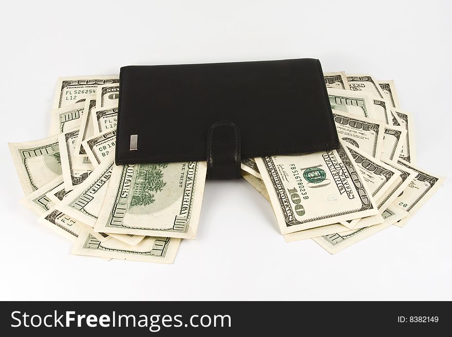 Leather wallet with money. Isolated on white background