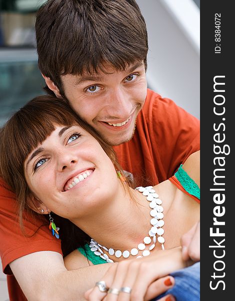 Young Smiling Teenagers Sit Together